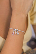 Pulseira c/ 3 berloques rosa